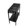 Grătar portabil negru pentru picnic, cu cărbuni, asamblat pe iarbă verde