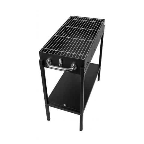 Grătar portabil negru pentru picnic, cu cărbuni, asamblat pe iarbă verde